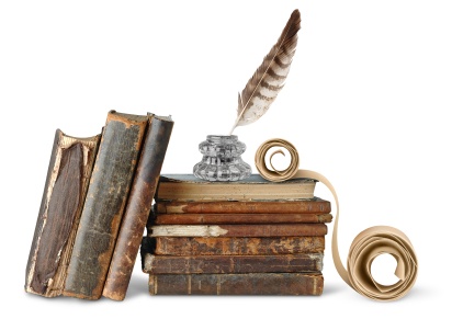 Stack of old books with quill pen and scroll