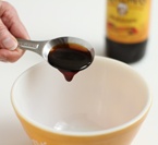 Molasses pouring from spoon
