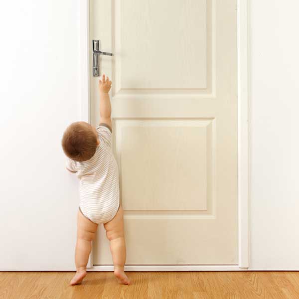 Toddler reaching for door