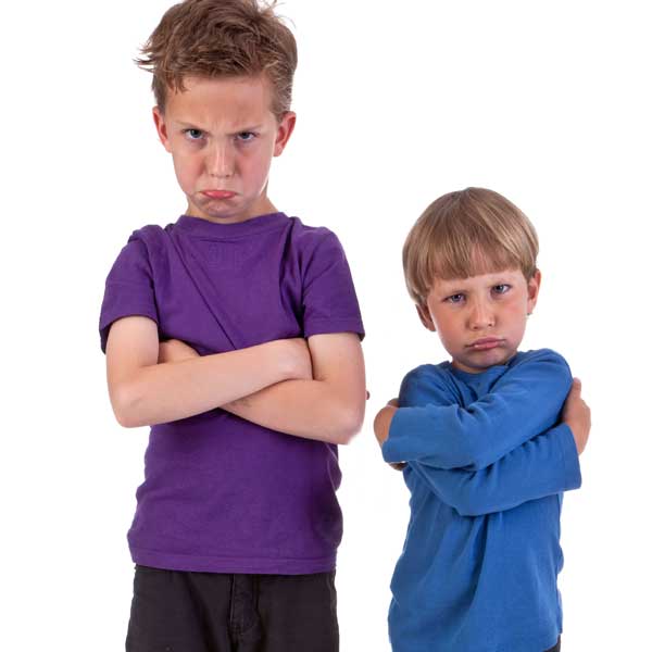 Two angry boys name-calling
