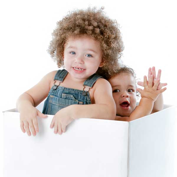 Toddler and baby in a box - sibling rivalry to sibling friends