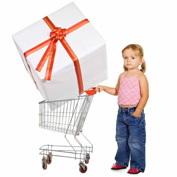Child shopping with big toy in cart