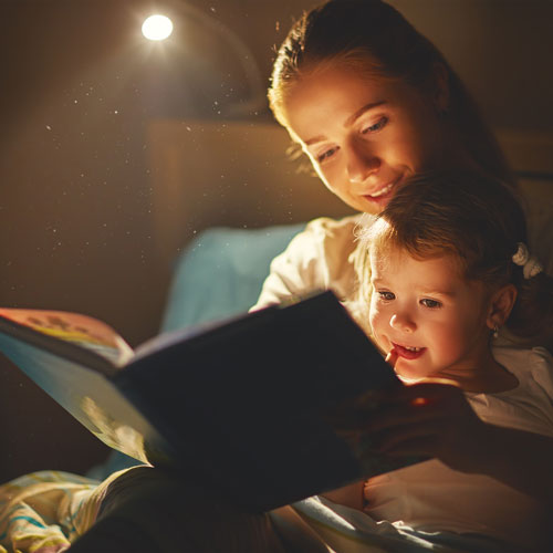 Mom and Son Reading at Bedtime
